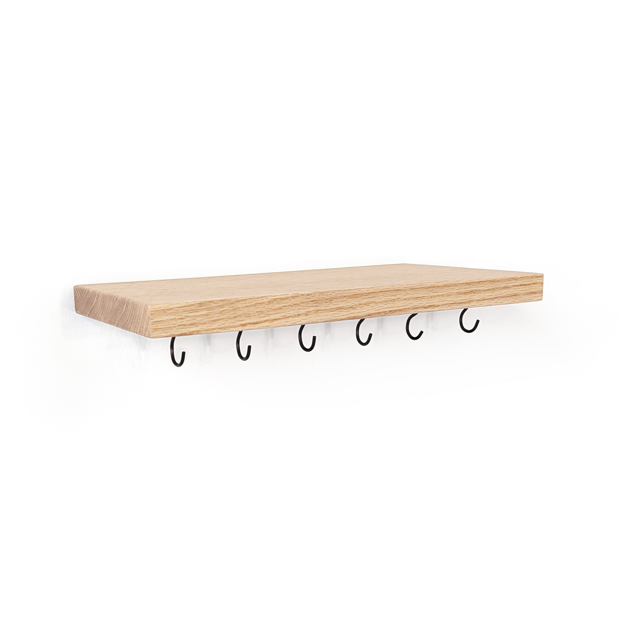 A maple wood floating shelf with five black metal hooks hanging underneath, shown against a plain white background.